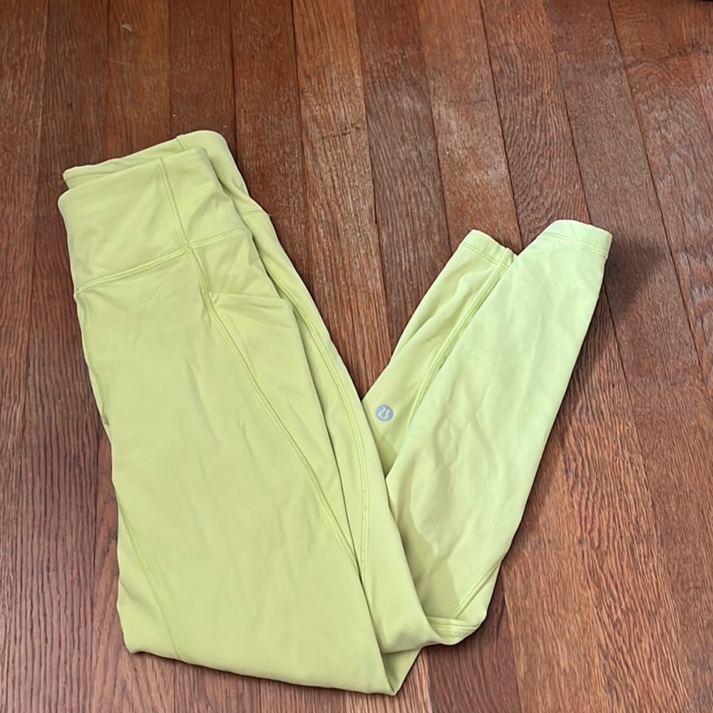 Lululemon yellow woman’s leggings size 2 with pockets on the side